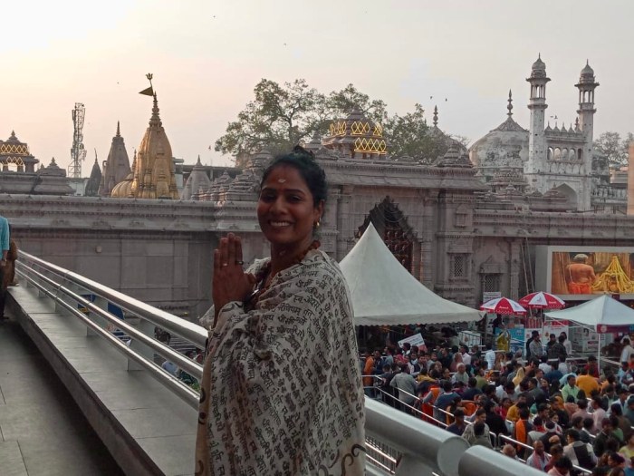 Standing at Kashi Viswanath temple in Varanasi, overlooking the crowd and temples